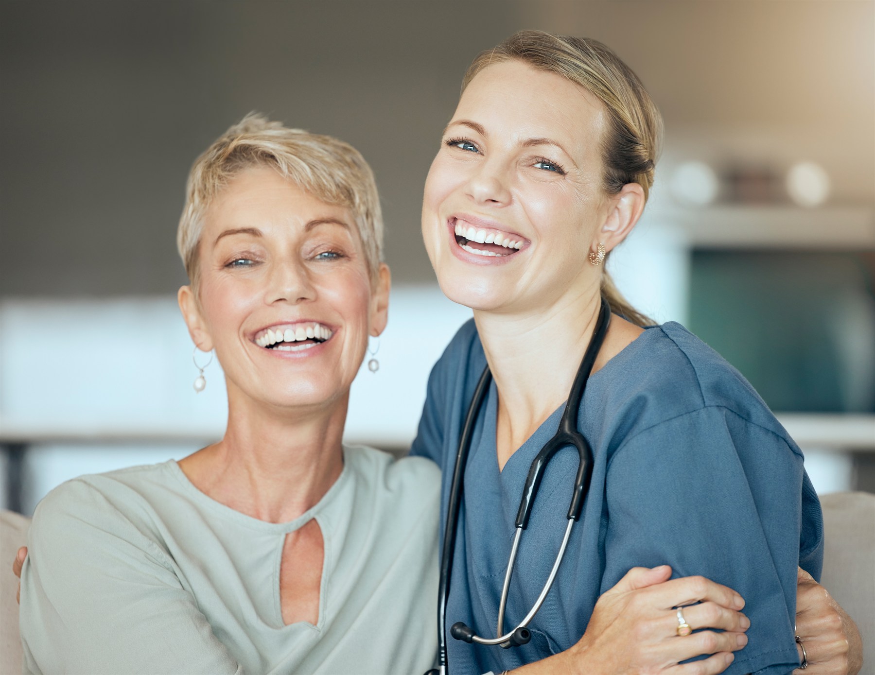 A patient sharing a warm moment with her healthcare professional